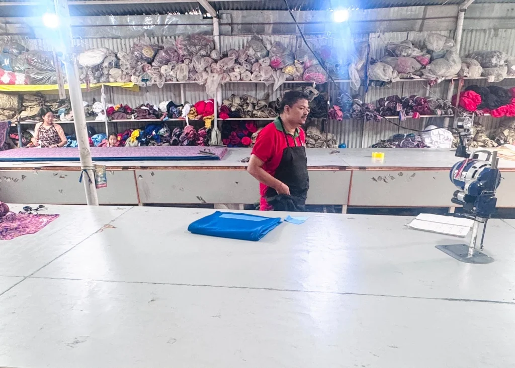 Master cutter cutting layered fabric stacks using vertical knife cutting machine